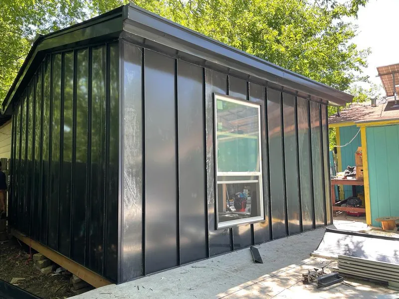 Black standing seam metal wall panels for Roof Inspection in Covington